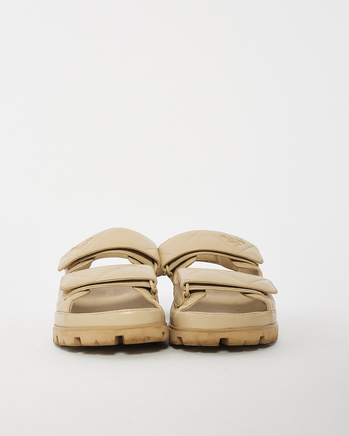 Prada Sandales sportives à bride arrière en cuir matelassé beige - 40