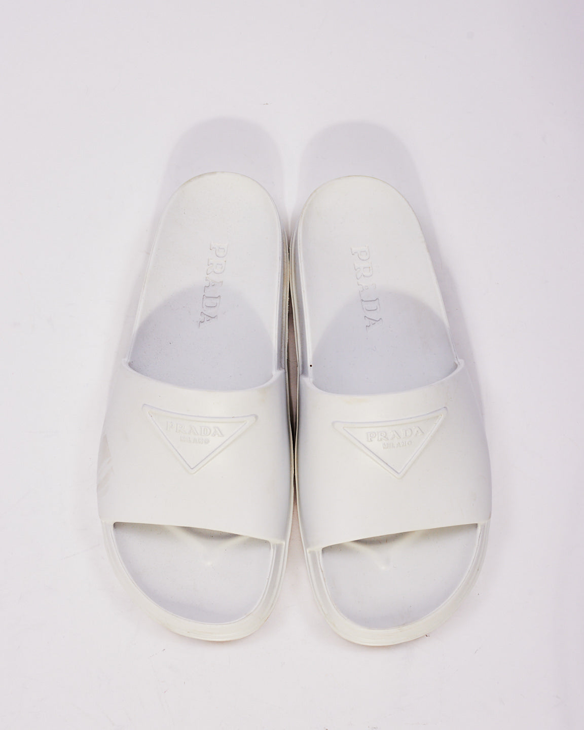 Prada White Rubber Triangle Logo Embossed Lug Sole Slides  - 38